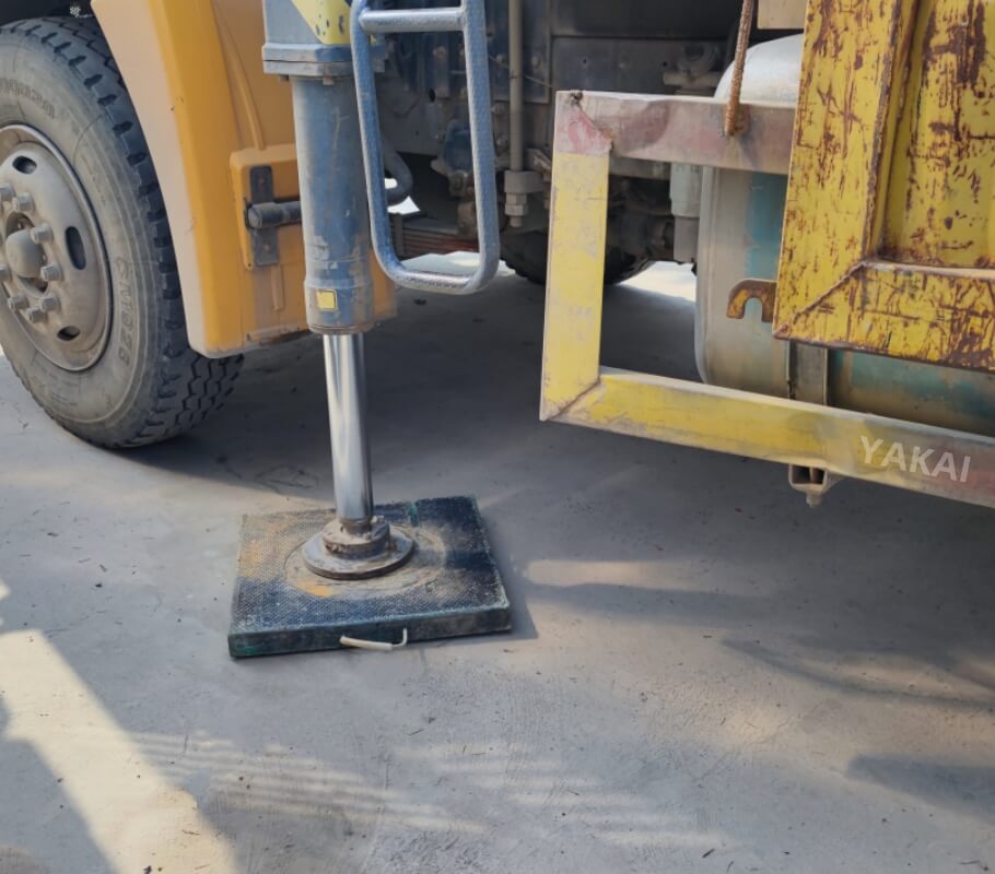 Close-up YAKAI crane outrigger pad under crane, long-term use