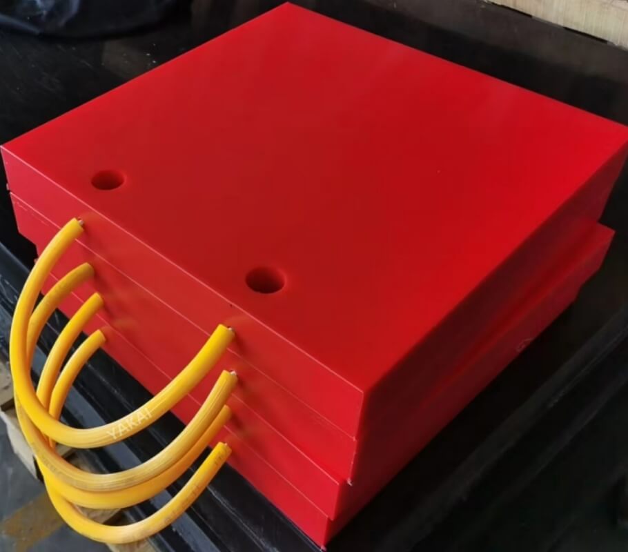 Red YAKAI crane outrigger pads, customizable colors